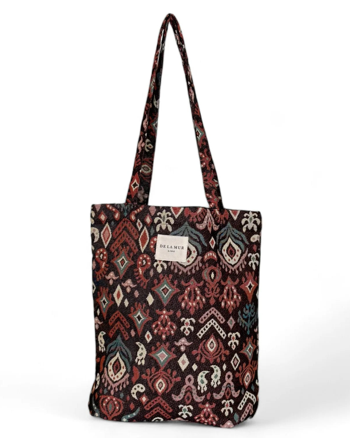 Tote bag de jacquard con estampado geométrico en tonos granates, vista frontal