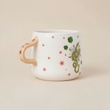 Taza serpiente y estrellas