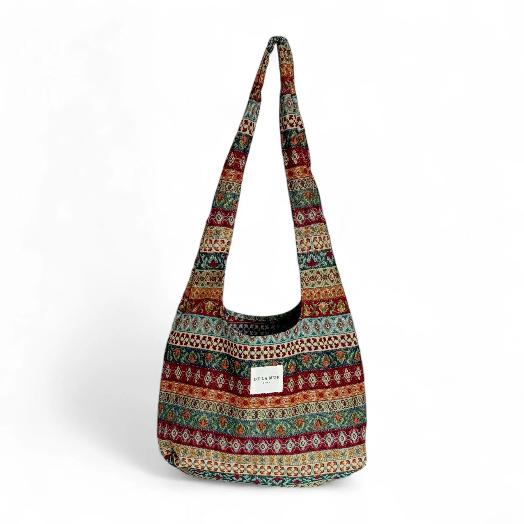 Tote bag de jacquard multicolor con estampado geométrico, vista frontal.