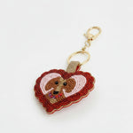 Charm bolso corazon y perro cuentas 