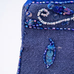 bolso-vintage-azul-lentejuelas-detalle-desgaste