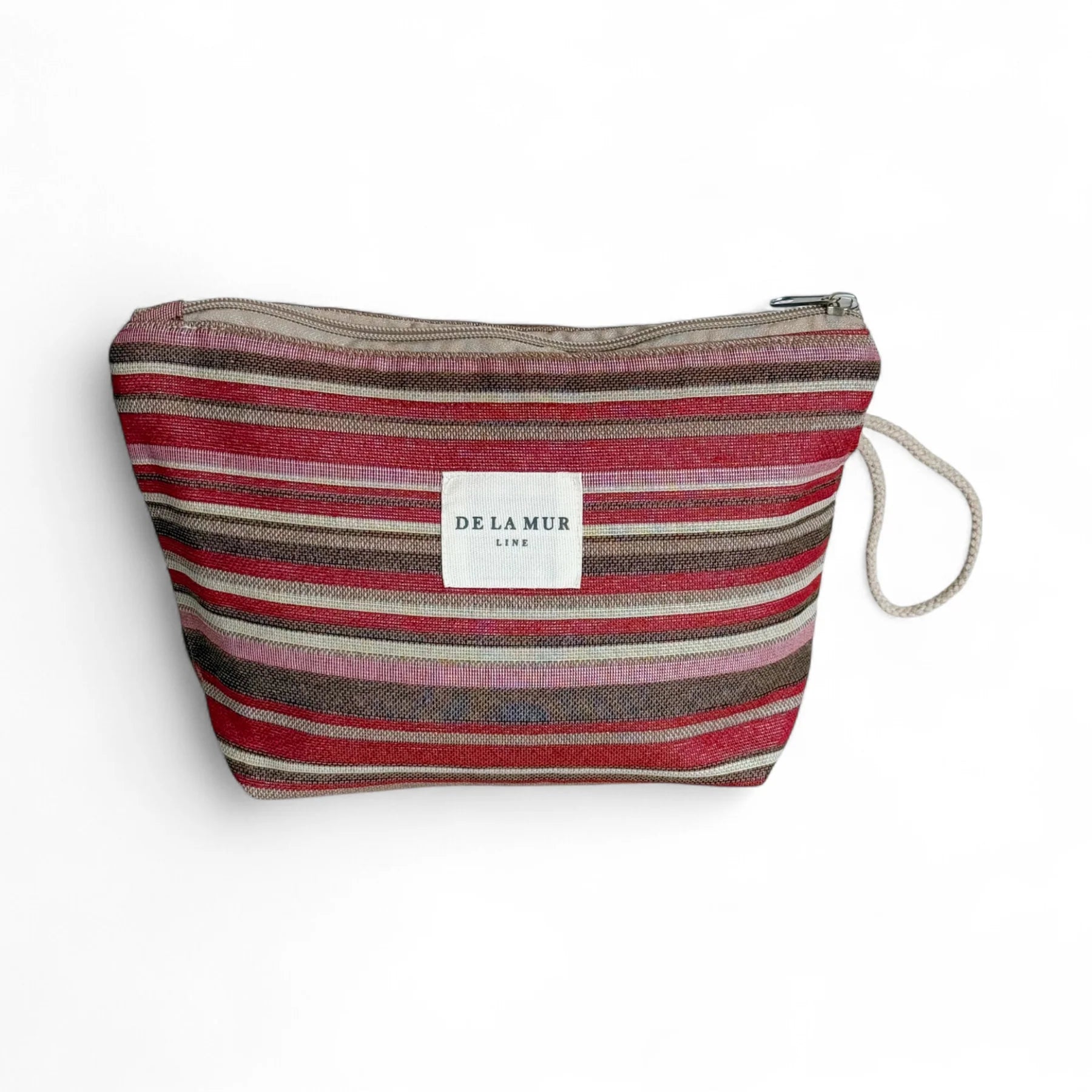 Neceser grande de jacquard con rayas multicolor y etiqueta De La Mur, vista frontal.