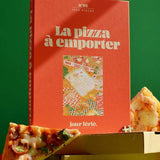 Caja roja del puzzle de 1000 piezas sobre cajas de pizza recicladas.
