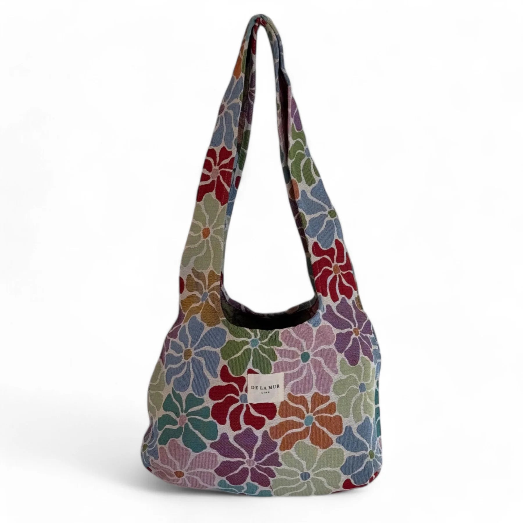 Bolsa ovalada de jacquard con flores multicolor, vista frontal.