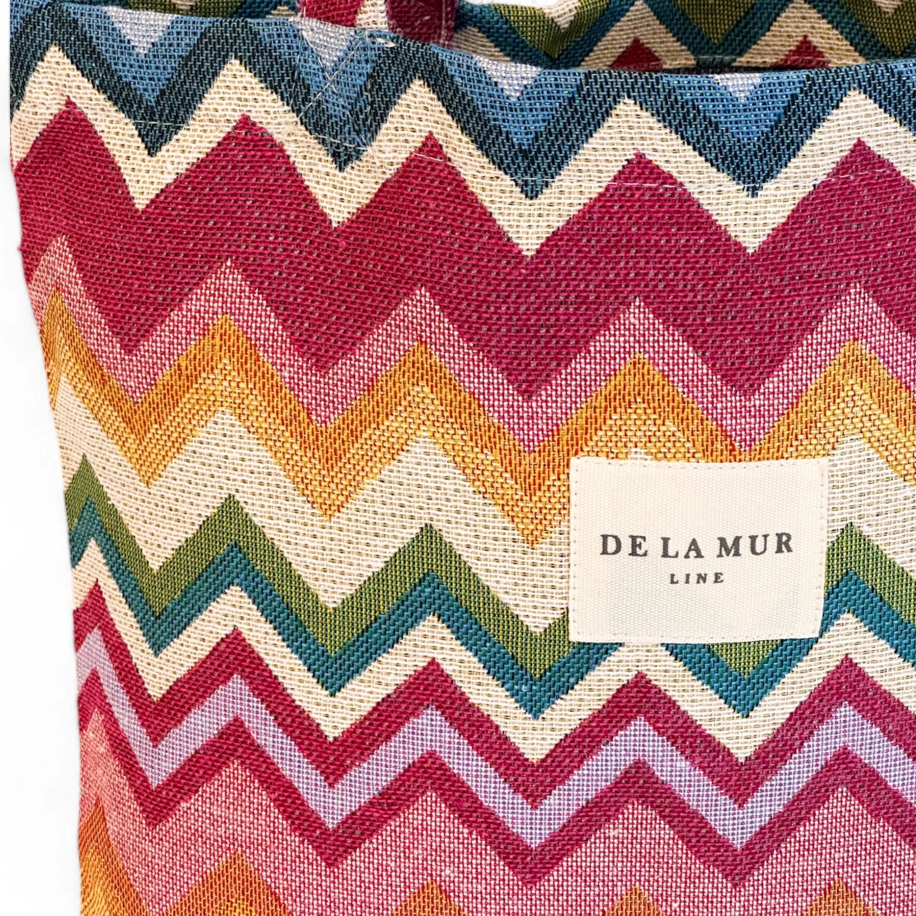 Bolsa de tela half-panamá con diseño geométrico en rosa, azul y verde