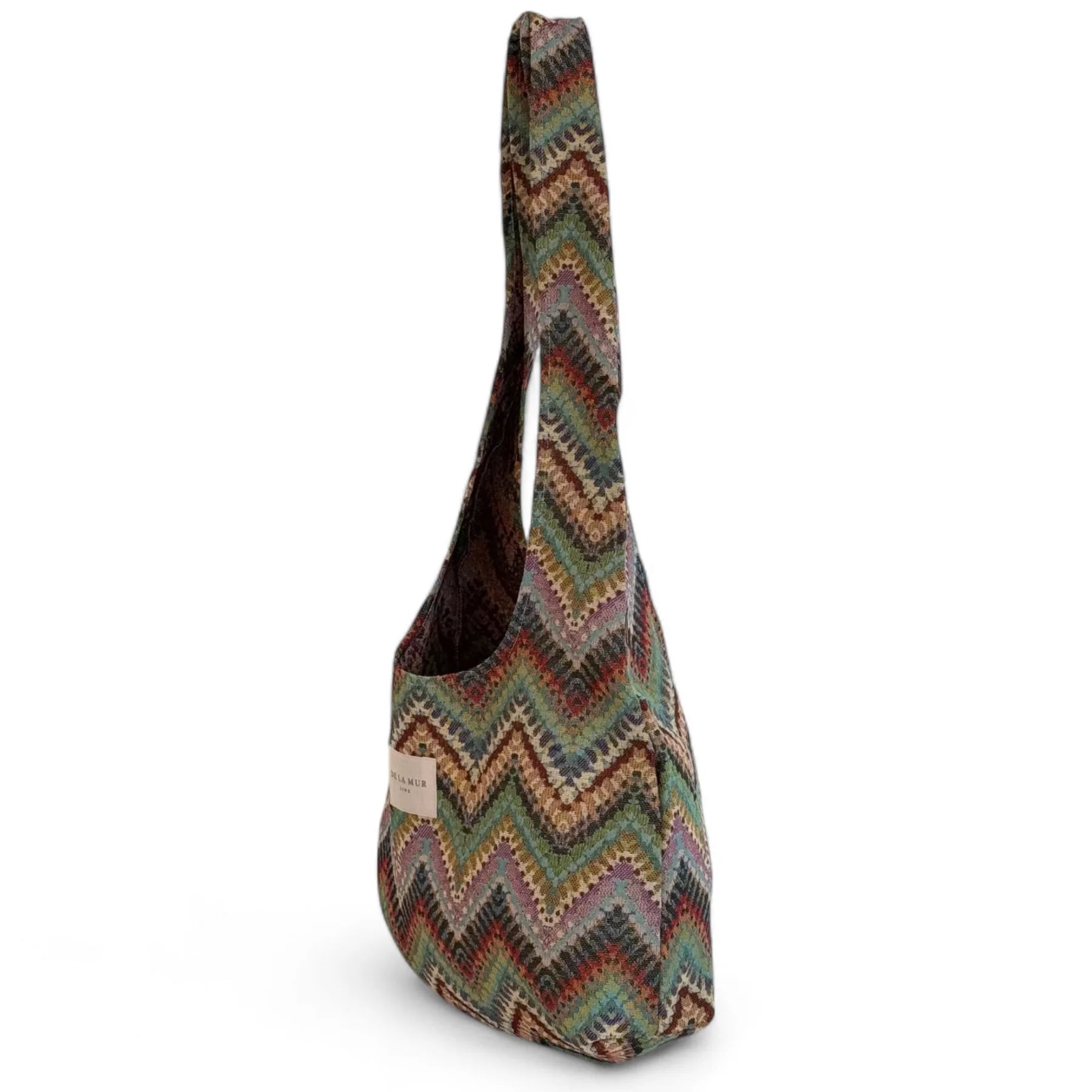 Bolso jacquard con asas largas, vista lateral.

