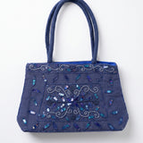 Imagen 1: Bolso vintage azul con bordados florales y lentejuelas en tonos azules.