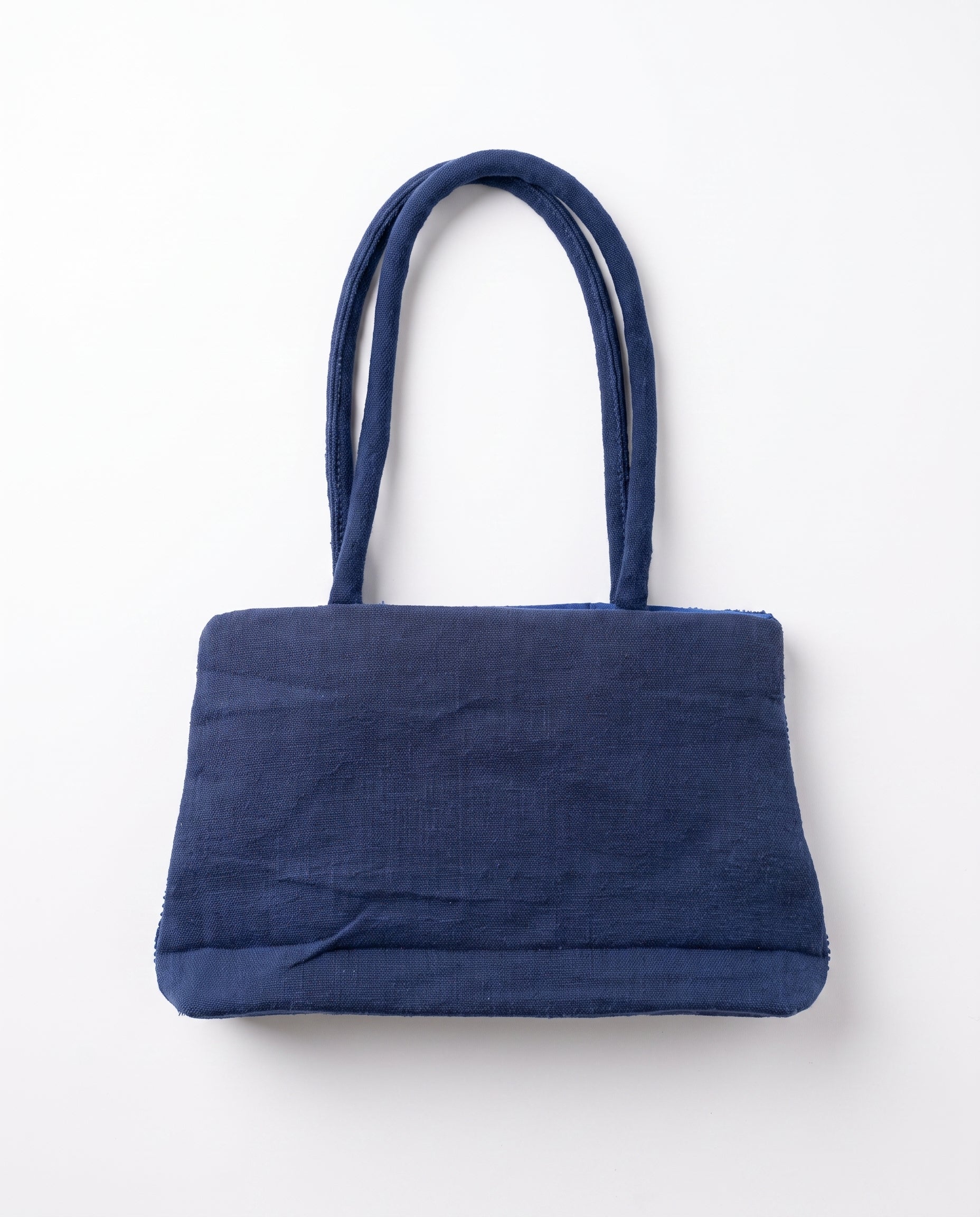 Imagen 3: Vista trasera del bolso vintage azul de hombro.
