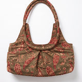 Parte trasera del bolso vintage bordado con asa de hombro.