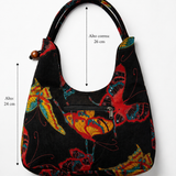 Bolso vintage negro con mariposas y lentejuelas mostrando sus medidas.