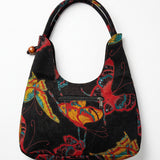  Vista trasera del bolso vintage de hombro con estampado de mariposas.