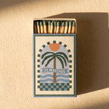 Vista frontal de la caja de cerillas ilustrada A Dopo con diseño de palmera.