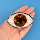 Brown eye hair clip