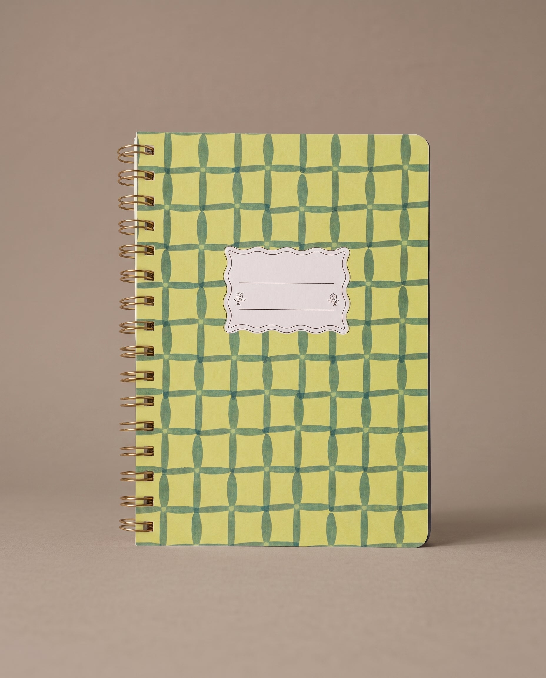 Libreta de espiral Green Lattice con estampado geométrico en tonos verdes.