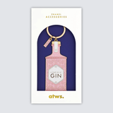 Detalle del llavero metálico chapado en oro con acabado brillante y etiqueta rosa.