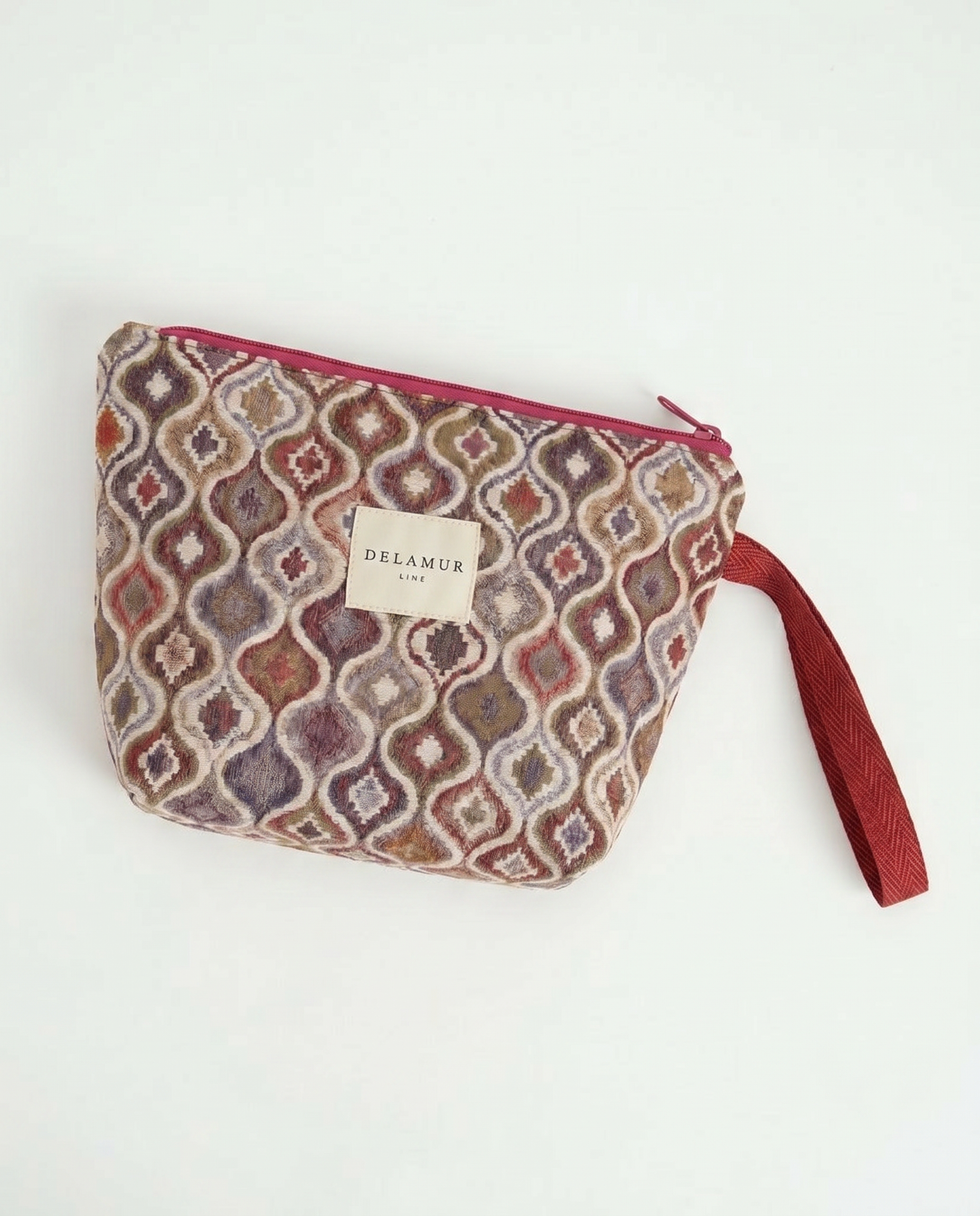 Neceser de jacquard con asa lateral rosa y cierre de cremallera.