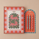 Pack de papelería con cuaderno de tapa dura Tigres A Dopo y set de tres bolígrafos de diseño.