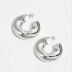 Pendientes plateados de diseño escultórico en acero inoxidable, estilo minimalista