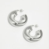 Pendientes plateados de diseño escultórico en acero inoxidable, estilo minimalista