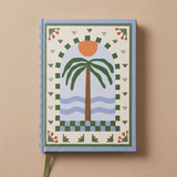 Vista frontal del cuaderno Palm Beach con tapa dura ilustrada.
