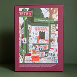 Parte trasera de la caja burdeos del puzzle Le Kiosque, con ilustración completa y texto descriptivo en francés.