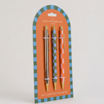 Set de tres bolígrafos A Dopo con diseños ilustrados y detalles dorados.