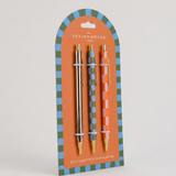 Set de tres bolígrafos A Dopo con diseños ilustrados y detalles dorados.