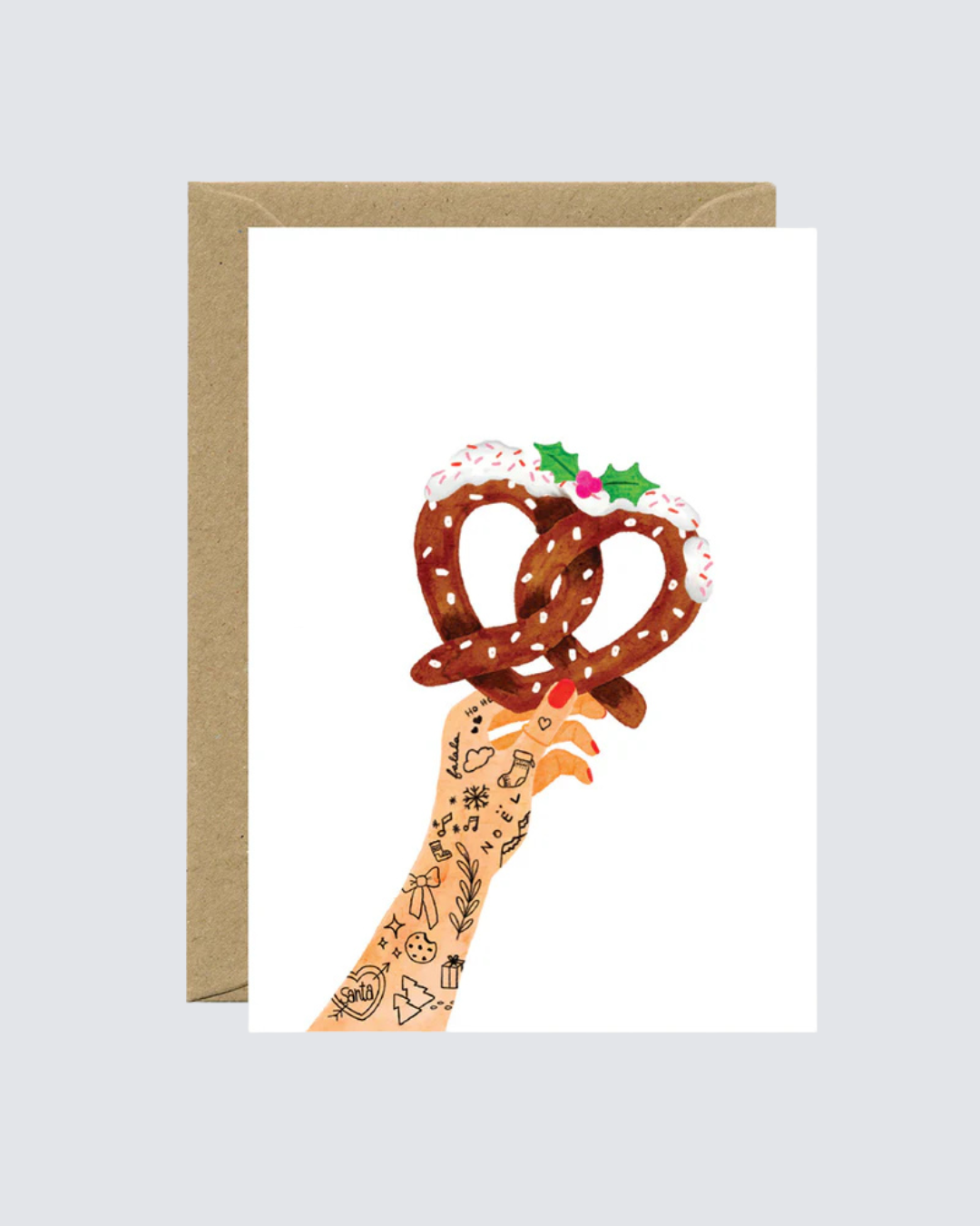 Tarjeta navideña con ilustración de mano tatuada sosteniendo dos pretzels con glaseado.