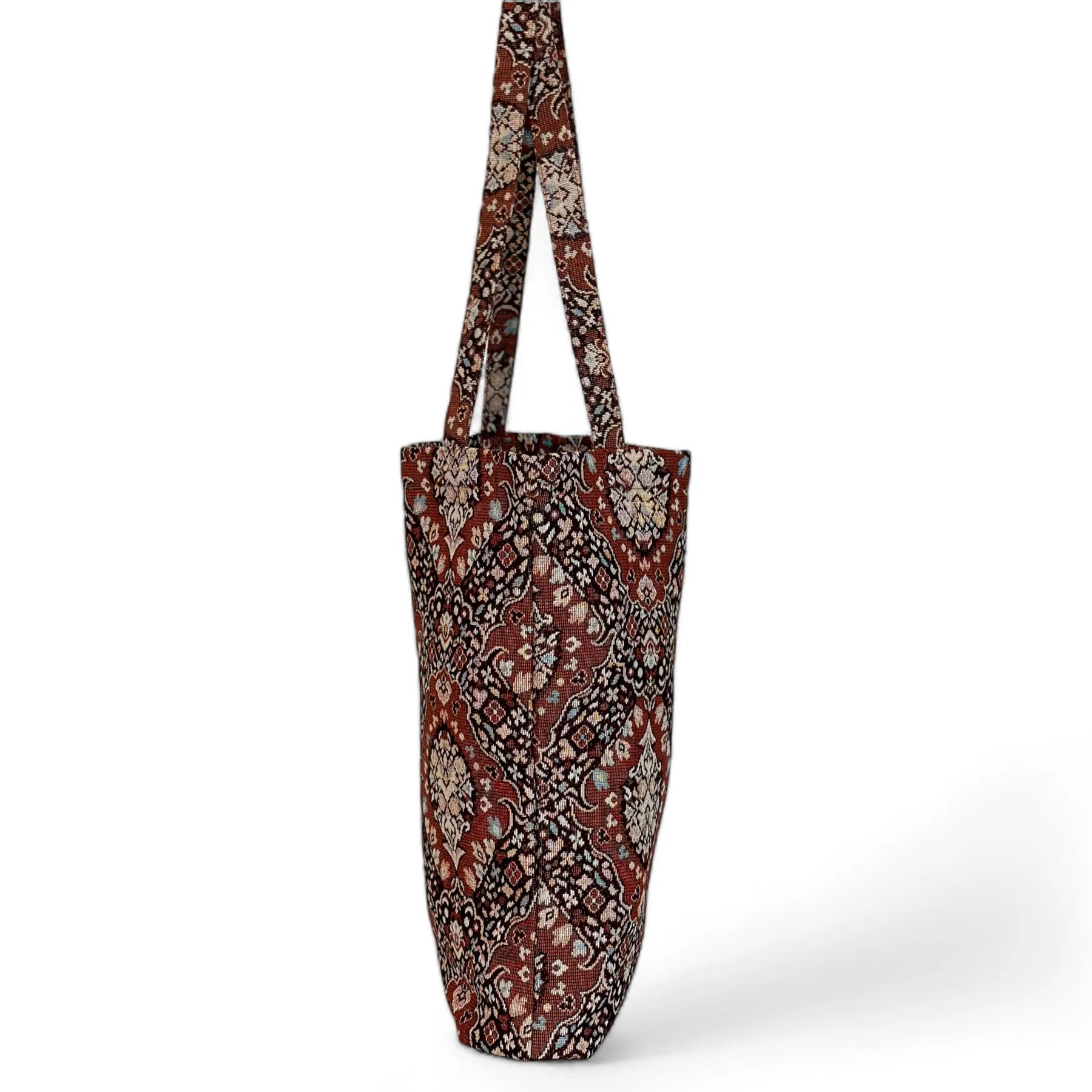 Bolsa tote colgada con diseño retro y patrón simétrico de inspiración vintage

