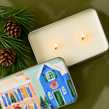 Vela navideña PADDYWAX abierta con dos mechas y cera de soja en lata decorativa.